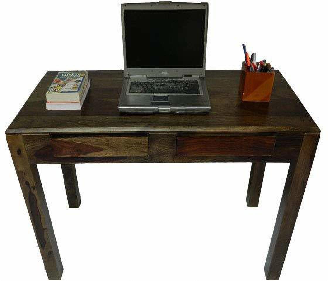 A rustic dark brown wooden writing desk with a single drawer, shown with a laptop, books, and a pencil holder on top against a white background.