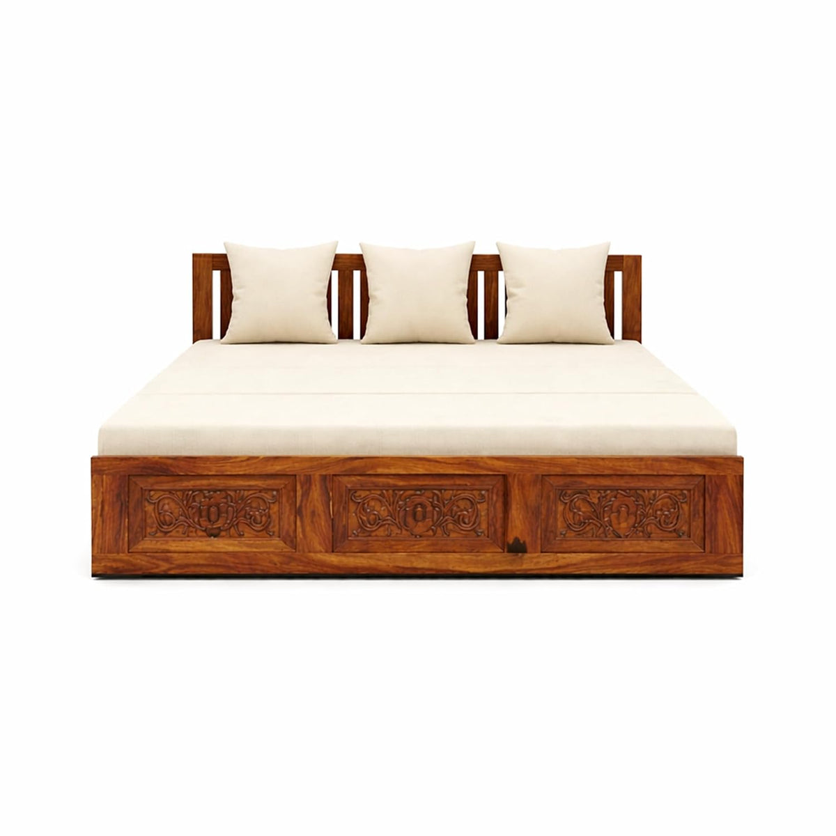 A sheesham wooden daybed with carved drawer-style front panels, upholstered in cream-colored cushions, shown against a plain white background.