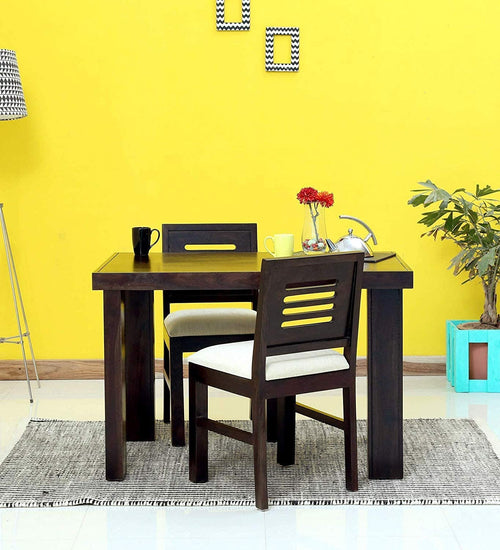 Capsule Hollow Cushion Solid Sheesham Wood 2 Seater Dining Table Set in walnut finish - side angle view